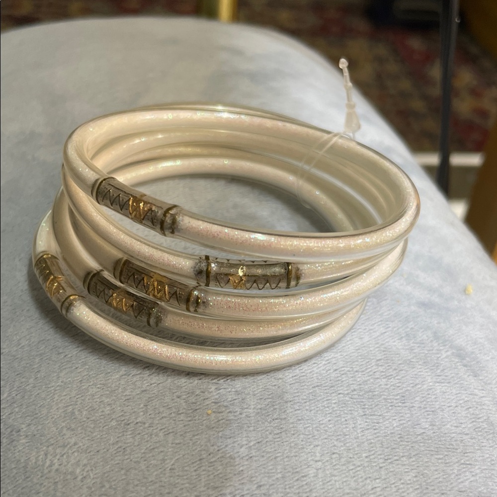 Set of White Bangles with Gold Accents